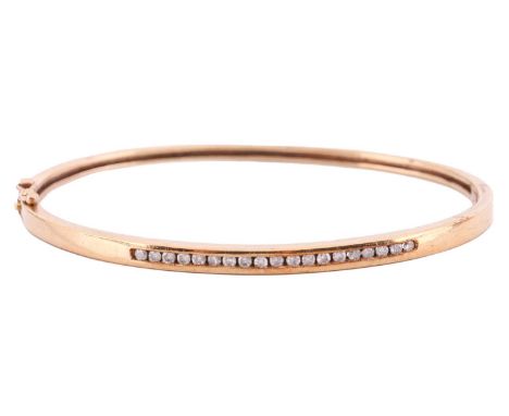 A diamond-set hinged bracelet in 9ct yellow gold, the front half of the bracelet channel-set with a line of diamond accents, 