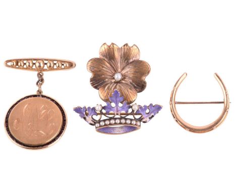 A group of four brooches; to include an enamel coronet brooch in floral design, set with seed pearls, yellow metal marked '14