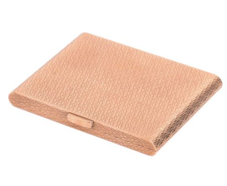 A 9ct yellow gold compact, of rectangular form with rounded sides, exterior surfaces decorated with engine-turned patterns, t