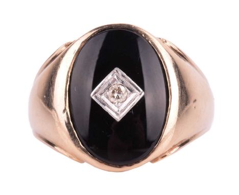 A signet ring set with onyx and diamond, the oval ring head centred with a square motif framing a diamond of 0.05ct, leading 