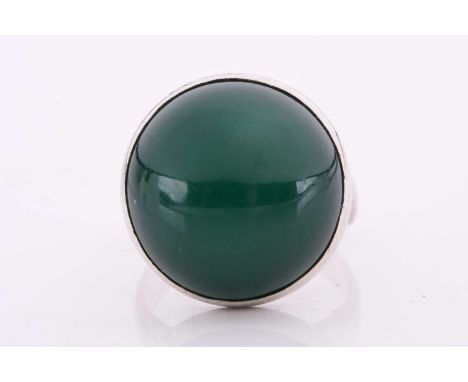 Georg Jensen - a green agate cabochon ring, collet-set to a tapering D-section shank, designed by Nanna Ditzel, No. 123G, pos