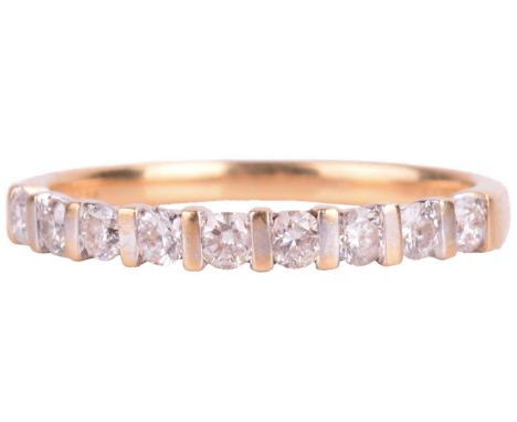A diamond half eternity ring in 18ct gold, bar-set with nine brilliant-cut diamonds with an estimated total weight of 0.31ct,