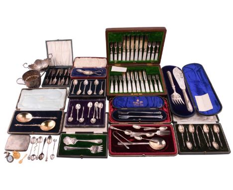 A quantity of flatware comprising a pair of silver gilt apostle spoons, a silver serving spoon, five silver coffee spoons, a 