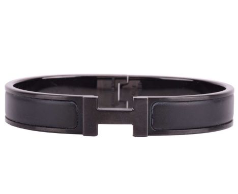 Hermès - a narrow 'Clic HH So Black' bracelet with matte enamel and plated hardware, signed and marked, inner diameter measur