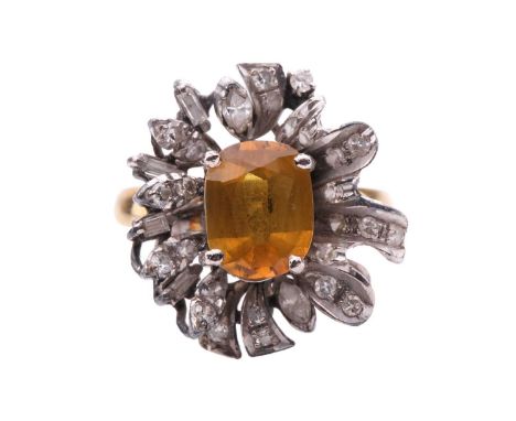 A yellow sapphire and diamond cluster ring, featuring a cushion-cut particoloured sapphire mainly with dark yellow body colou