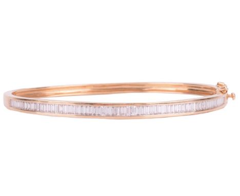 A diamond-set hinged bracelet, bangle constructed with two halves, where one side has been channel-set with an array of bague