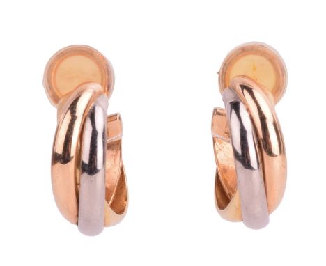 Cartier - a pair of trinity clip-on earrings, each comprising three intertwined bands in different colours, completed with om