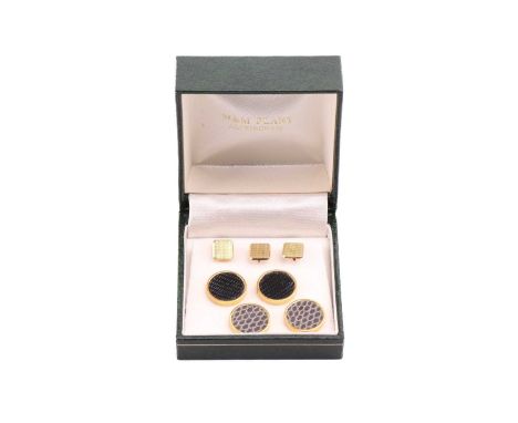 A set of three shirt studs in 18ct yellow gold, canted square panels with engine-turned patterns, struck with London import m
