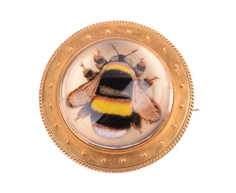 A Victorian Essex crystal bee brooch, the round rock crystal cabochon reverse intaglio naturalistically depicts a bumblebee, 