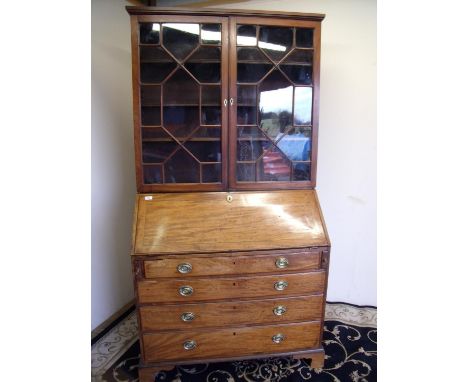 19th C mahogany bureau bookcase with two upper glazed doors above fall front revealing fitted interior above four long drawer