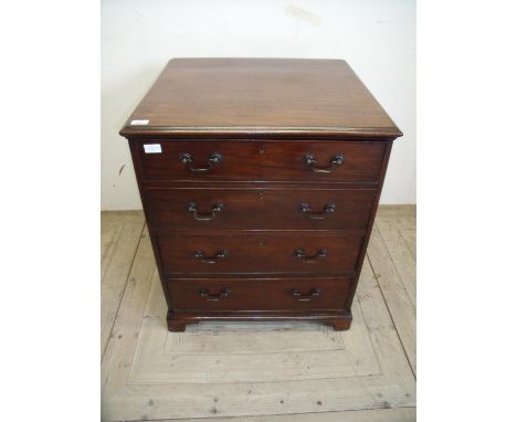 Mahogany deep chest of small proportions with fall front above two drawers on raised bracket feet (64cm x 59cm x 77cm) 