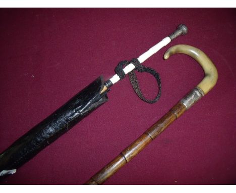 Silver hallmark collared Edwardian walking stick with rams horn handle and a similar black parasol with outer waxed cover, ri