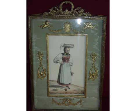 19th C gilt frame with green washed silk work border with gilt mounts depicting swags and foliage, with a French book plate c