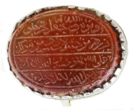 A very old Islamic silver ring dating back to the 17th-18th century. It carries a large jade stone. On the stone verse 4 of S