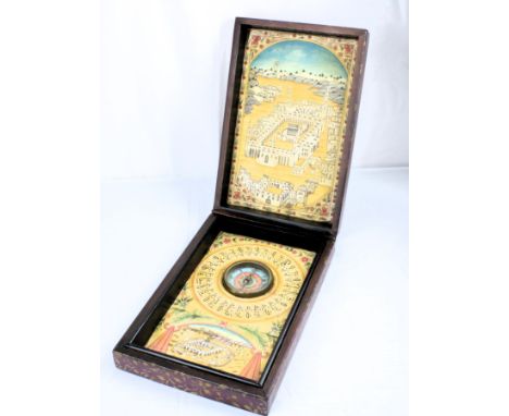 This rectangular wooden box holds a Compass with Qibla indicator. The outside is decorated with painted, gilded decorations o