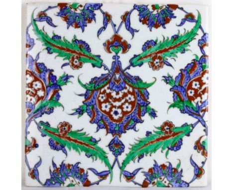 A beautiful Iznik tile with characteristic botanical decorations. Central on this tile there is a representation of pomegrana