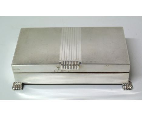 A 1960s silver cigar box, of typical form with engine turned decoration, raised on four feet, hallmarks for Charles S Green &