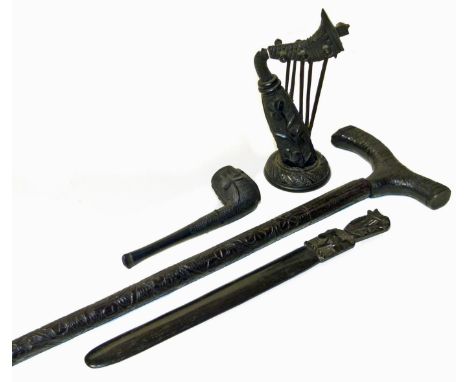 Bog oak walking stick, letter opener, harp and pipe. Condition reports are not available for our Interiors Sales