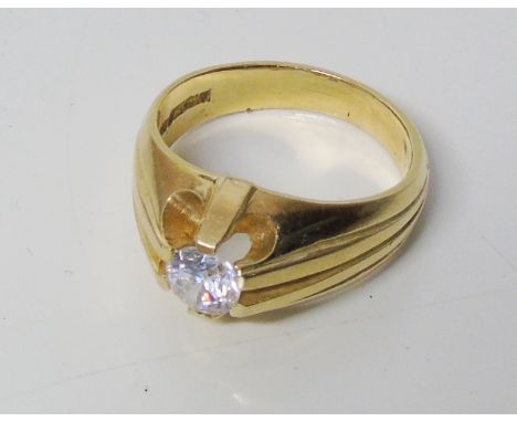A zircon signet ring, the circular colourless zircon within a claw setting inset to the tapered band, stamped 14K, ring size 