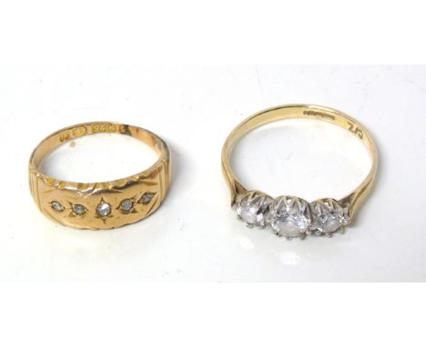 Two rings, to include a 9ct gold cubic zirconia three stone ring and a 15ct gold diamond band ring, ring sizes N and H1/2, gr