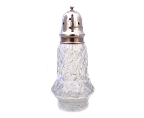 A 1960s silver topped cut glass caster, The baluster cut glass bottle with plain silver rim and detachable silver domed lid w