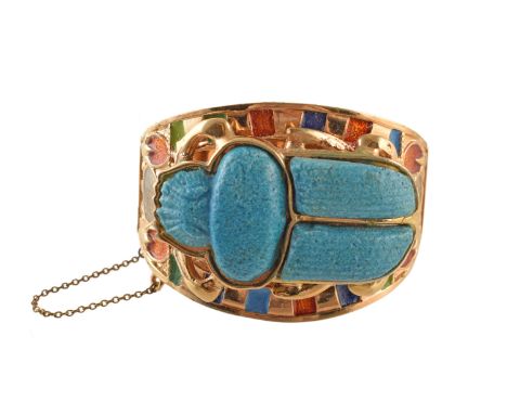 A 1970's Egyptian Revival scarab bangle by Thomas Fattorni Ltd, the large imitation faience scarab beetle carving, atop the v