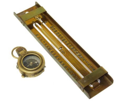 Brass WWI (1918) compass and Brannan (London) thermometer in brass case dated 1954. Condition reports are not available for o