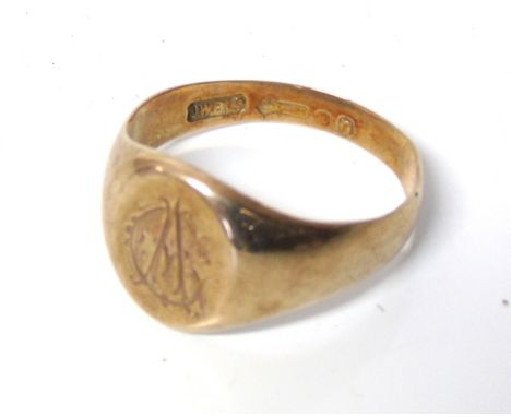 A 9ct gold signet ring, the oval shape panel with 'AC' monogram, hallmarks for London, ring size X, gross weight 6.8g. Condit