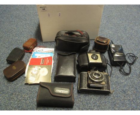 Box of assorted cameras and camera equipment to include: various compact cameras; Compur folding Reprographic camera; Brownie