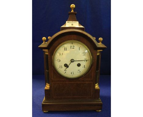 Early 20th Century inlaid mahogany two train heart shaped mantel clock raised on four pad type feet, the drum shaped movement
