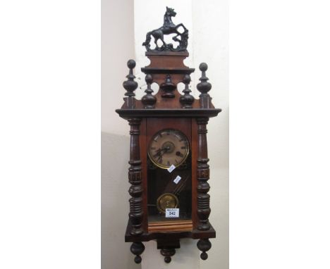 Small early 20th Century two train Vienna type wall clock with horse pediment, includes key and pendulum.(B.P. 24% incl. VAT)