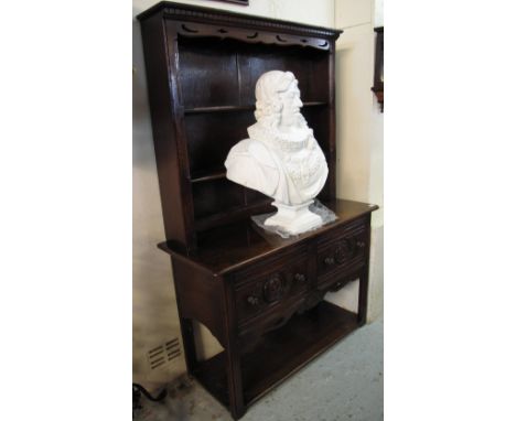 Good quality reproduction oak carved two stage rack back potboard dresser. (B.P. 24% incl. VAT)   CONDITION REPORT:  Base - 1