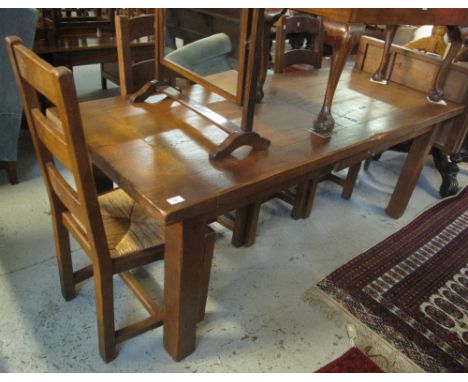 Large modern single drawer oak dining table on large square legs, together with a set of four oak ladder back chairs with rus