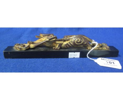 Chinese lacquered and gilded scroll weight in the form of a dragon with stylised Lingzi fungus. 23.5cm long. (B.P. 24% incl. 