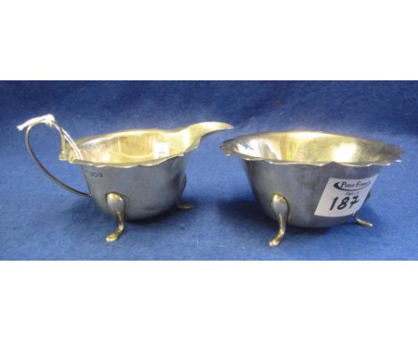 Silver cream jug raised on pad type feet with matching sucrier, Sheffield hallmarks, maker's initials: E.B.  6 Troy ozs appro