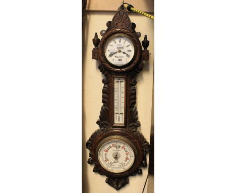Late Victorian carved oak aneroid barometer with clock and thermometer, by Andrew Christie of Glasgow.(B.P. 24% incl. VAT)