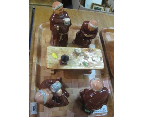Novelty pottery jolly monk figure group playing cards and drinking.(B.P. 24% incl. VAT)
