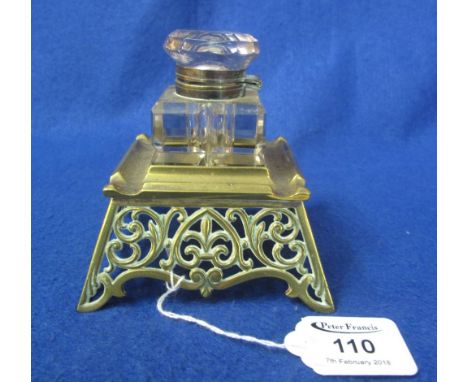 Foliate pierced brass inkstand with square shaped, facet cut glass inkwell, having hinged cover.(B.P. 24% incl. VAT)
