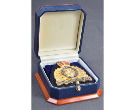 Estate of Dave Prowse - Mr Prowse's personally presented Royal Canadian Mounted Police badge. The badge gold plated, with ena