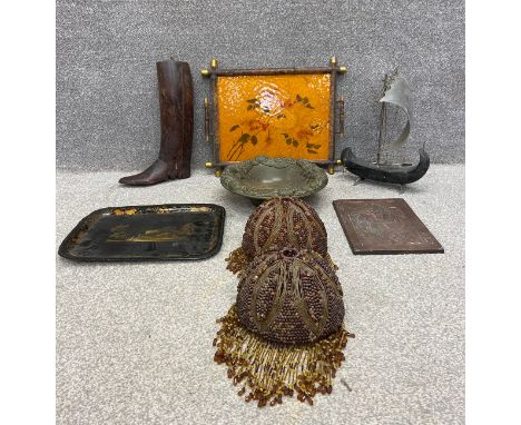 A boot last, two trays, a chalk bowl, a galleon, two lamp or ceiling shades and a copper playing card. L.57 W.47cm (tray) L.5