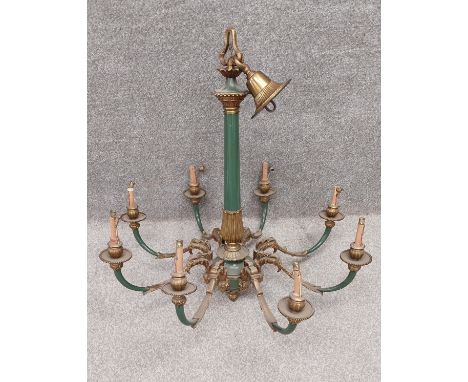 A late 19th century brass and green enamel chandelier with a classical style central column leading down to eight branches wi
