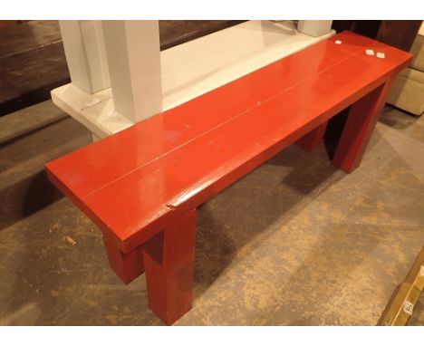 Small red wooden bench