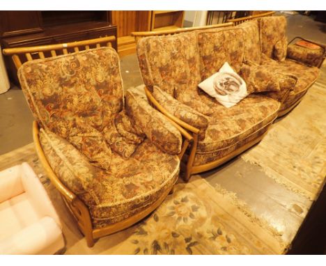 Ercol upholstered three piece suite, comprising two settees and a chair CONDITION REPORT: This item is in generally good cond
