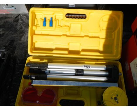 A cased tripod with level etc.