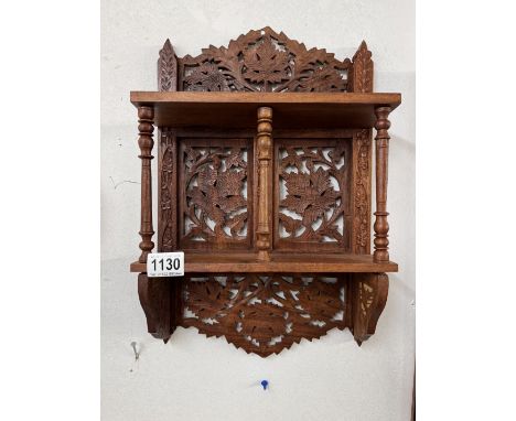 A Carved wooden wall hanging shelf