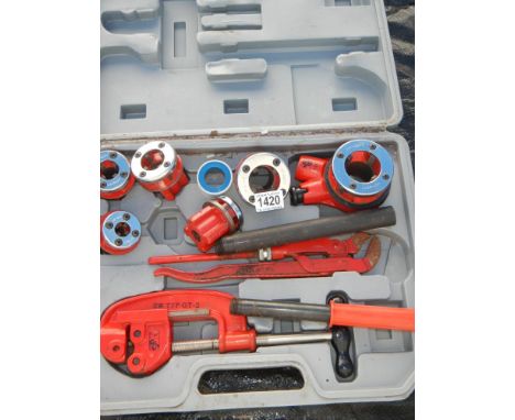 A plumbers pipe thread tool kit