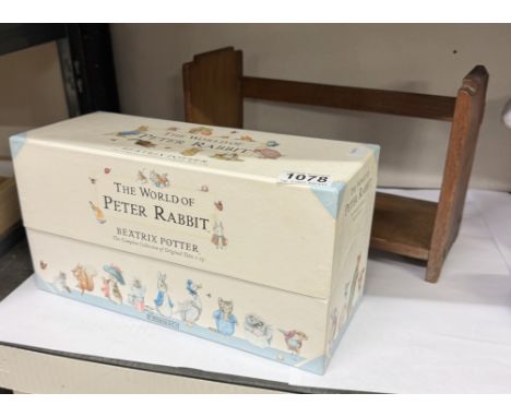 A boxed set of Beatrix Potter The World Of Peter Rabbit books &amp; A vintage bookshelf