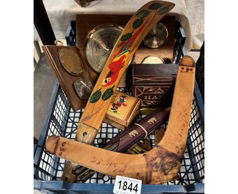 A tray of wooden items including Aboriginal boomerang etc