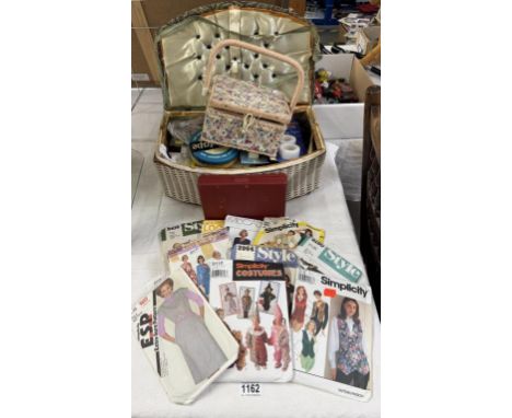 A quantity of vintage sewing patterns, basket &amp; contents