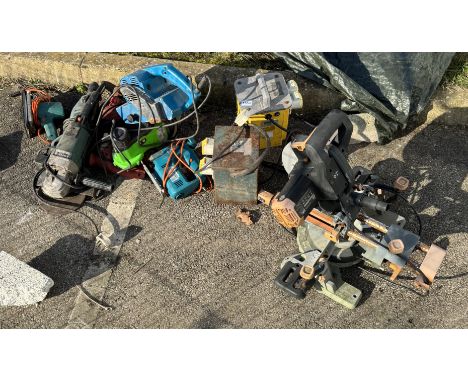 A quantity of power tools including drills, an angle grinder etc